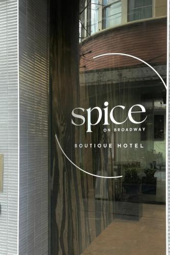 a sign on a window of a boutique hotel at Spice On Broadway in Sydney