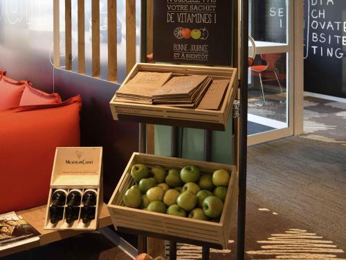 a crate of apples on a stand in a store at ibis Honfleur in Honfleur