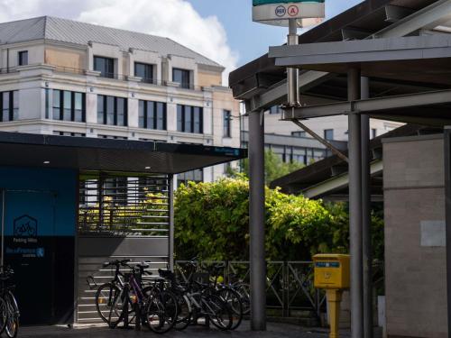 a group of bikes parked in front of a building at ibis Marne La Vallée Val d'Europe in Montévrain