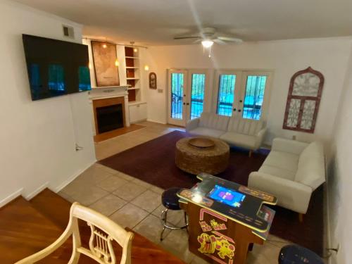 an aerial view of a living room with a table at Willy Wonka House in Pensacola