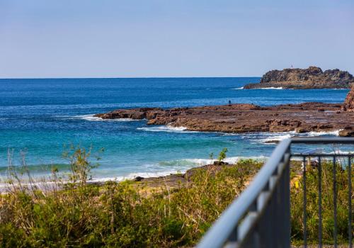 a view of the ocean from a balcony at Bombo Breeze in Kiama
