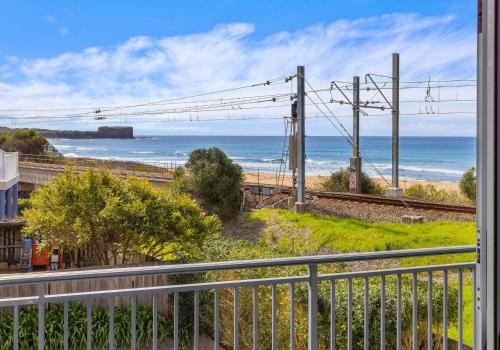 a view of the ocean from the balcony of a house at Bombo Breeze in Kiama