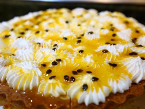 a close up of a cheese pizza with black seeds at ibis Rio de Janeiro Santos Dumont in Rio de Janeiro