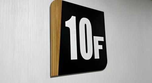 a sign with the number on a wall at Goodrich Hotel in Hong Kong