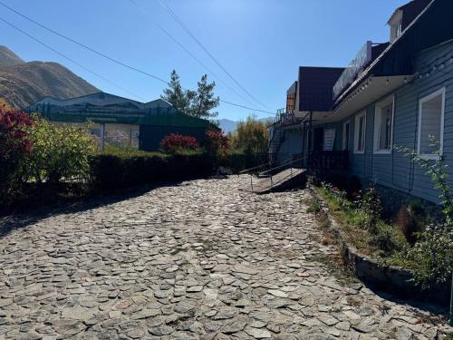 a cobble stone road next to a house at Timur Resort Turgen in Taūtürgen