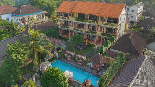 an aerial view of a mansion with a swimming pool at Pondok Kutuh Guest House in Ubud