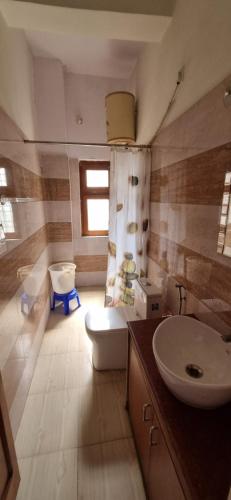 Koupelna v ubytování Farmstay near Corbett