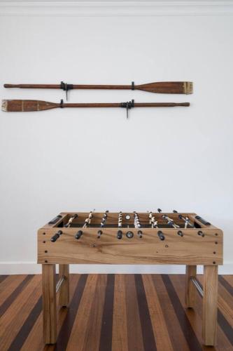 a wooden bench with oars on top of it at Creekhouse by the Sea - Private Jetty and Serene Views in Frankston East