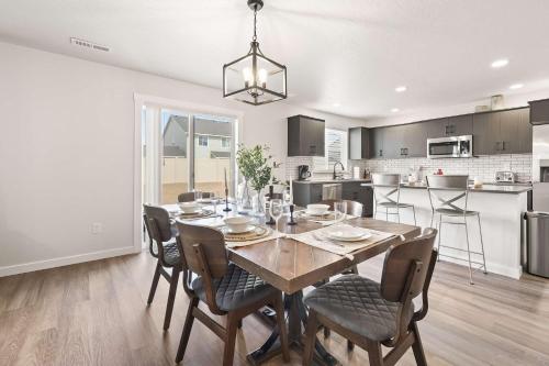a kitchen and dining room with a table and chairs at 6BR Retreat with Playground Basketball & Sleeps 22 in Star
