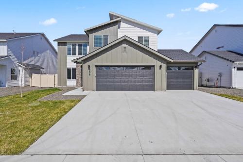 a house with a garage in a residential neighborhood at 6BR Retreat with Playground Basketball & Sleeps 22 in Star