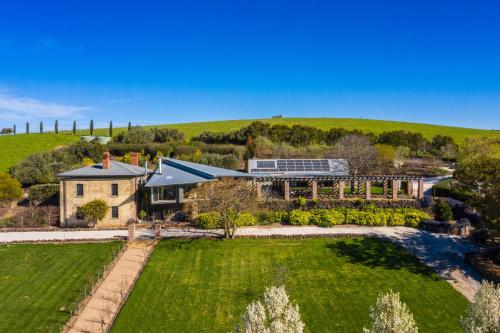 an aerial view of a house with a garden at Vale Hill House in Lawrence