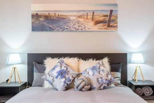 a bedroom with a bed with a stuffed animal on it at Boutique Double Room in Carramar - Close to Station & Shops - Shared Bathroom in Villawood