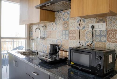 Η κουζίνα ή μικρή κουζίνα στο The Enclave Inn