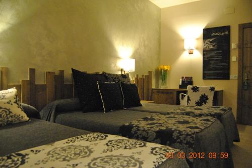 a hotel room with two beds in a room at Santa Bárbara in Sant Corneli de Cercs 
