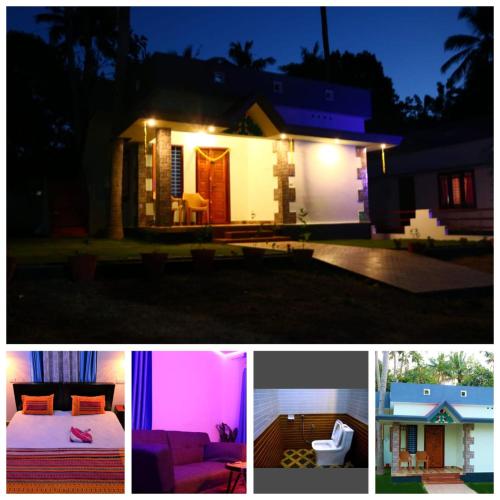 a house lit up at night with lights at BHASKAR VILLA RESORTs in Varkala
