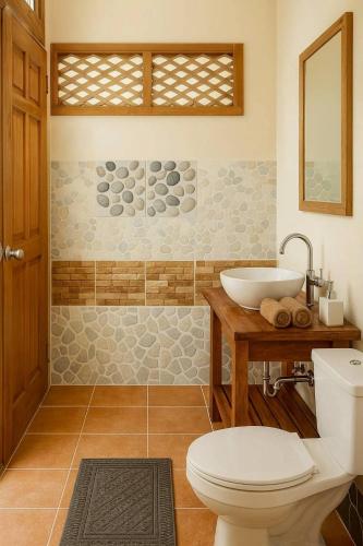 a bathroom with a toilet and a sink at Teak House Lanta-6 Mins Walk To Beach in Ko Lanta
