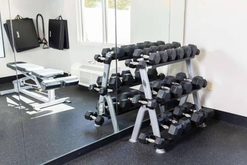 a room with a gym with a rack of weights at Country Inn & Suites Etown in Elizabethtown