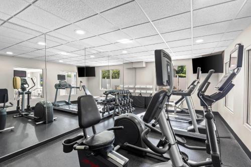 a gym with treadmills and elliptical machines at Country Inn & Suites Etown in Elizabethtown