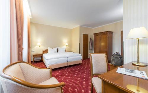 Postel nebo postele na pokoji v ubytování Trip Inn Stadthotel Coburg