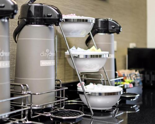 a row of coffee machines on a counter at Sleep Inn & Suites Fort Scott in Fort Scott