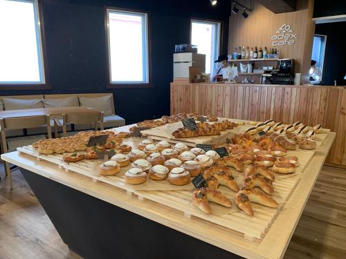 a table with different types of pastries on it at adex Inn in Noboribetsu