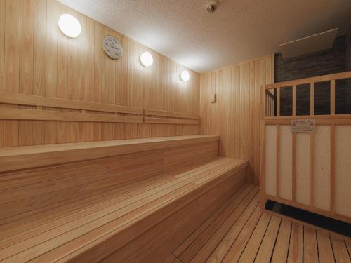 an empty gym with a clock on the wall at Hotel Route Inn Kyoto Kumiyama in Kyoto