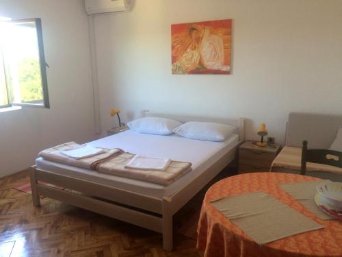 Postel nebo postele na pokoji v ubytování Apartments Radulović