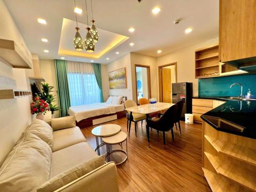 a living room with a couch and a table at FLC Sea Tower Quy Nhơn- View Biển in Quy Nhon