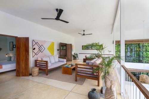 Ένα ή περισσότερα κρεβάτια σε δωμάτιο στο Awimbawei House