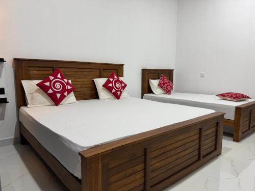 Postel nebo postele na pokoji v ubytování Miracle Home Stay
