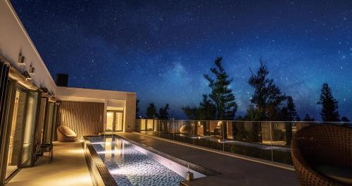 a balcony of a house with a starry sky at UMITO Okinawa Onnason in Onna