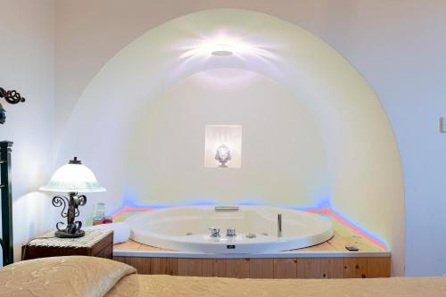a bathroom with a large white sink in a room at Villa Martina in San Vito dei Normanni