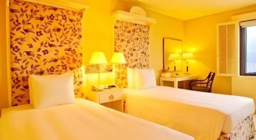 Postel nebo postele na pokoji v ubytování Regency Art Hotel