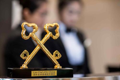 a gold trophy with a heart on top of it at Sofitel Legend People's Grand Hotel Xi'an in Xi'an