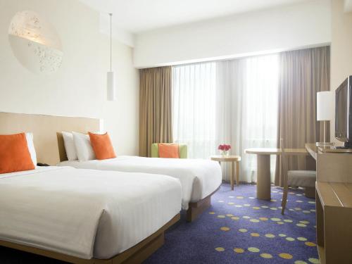 Letto o letti in una camera di Novotel Bandung
