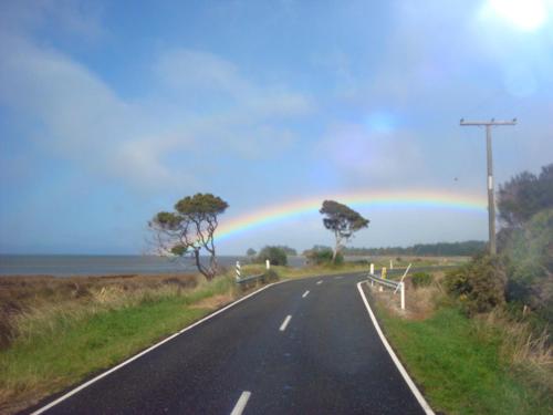 a rainbow on the side of a road at The Station House Motel in Collingwood