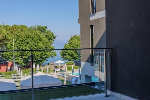 a balcony with a view of a pool at Hotel San Marco in Bardolino