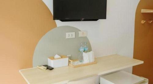 Télévision ou salle de divertissement dans l'établissement Pool Villa @Donmueang