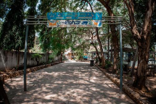 a street sign in the middle of a road at Hotel & Apartment Serene in Dar es Salaam