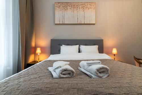 Ένα ή περισσότερα κρεβάτια σε δωμάτιο στο Jakobsoni apartment