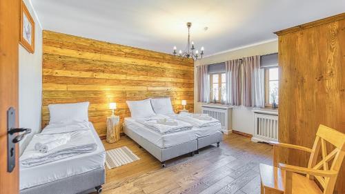 Ένα ή περισσότερα κρεβάτια σε δωμάτιο στο Stara Piekarnia