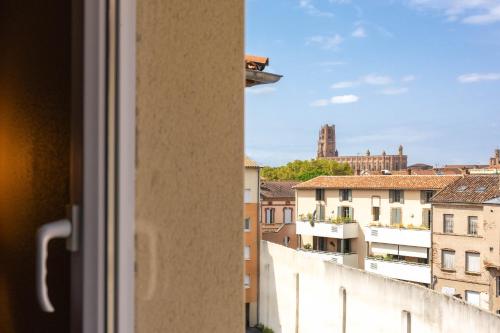 a view of a city from a window at Ibis Albi in Albi