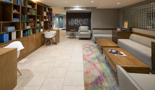 a library with a waiting room with a rainbow rug at The Kinney - Venice Beach in Los Angeles