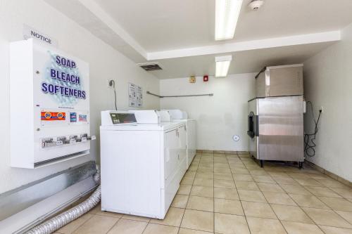 a kitchen with a refrigerator in a room at Motel 6 Tempe, AZ Phoenix Airport Priest Dr in Tempe