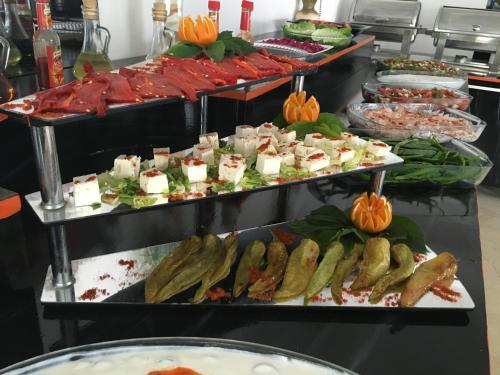 a buffet with many different types of food on display at Salinas Hotel in Gümbet