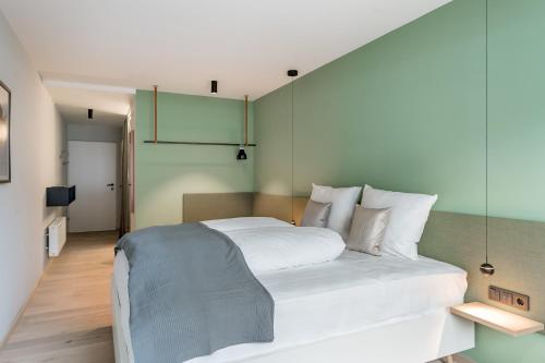 Postel nebo postele na pokoji v ubytování Lifestylehotel Das Max