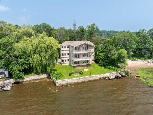 an aerial view of a house on a river at Incredible view - Chateau au bord du fleuve in Saint-Augustin-de-Desmaures