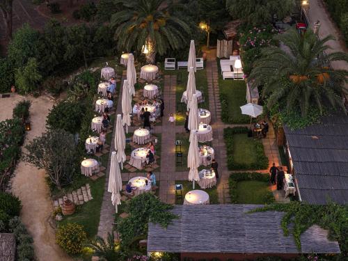 an overhead view of a restaurant with tables and umbrellas at Le Calette N.5 in Cefalù