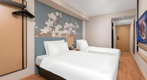 Ένα ή περισσότερα κρεβάτια σε δωμάτιο στο Magnotel Classic Shenyang General Hospital of Northern Theater Command