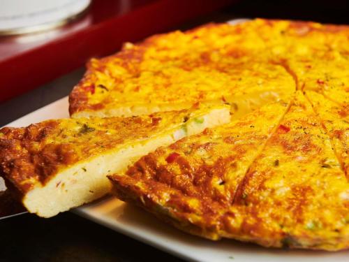 two slices of cheese pizza on a plate at Sofitel Guangzhou Sunrich - Free Shuttle Bus to Canton Fair Complex & Overseas Buyer Registration Services during Canton Fair Period in Guangzhou